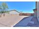 Spacious backyard featuring gravel, block wall, pavers, and potential for outdoor activities at 226 W Crimson Sky Ct, Casa Grande, AZ 85122
