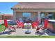 Charming backyard with outdoor fire pit, comfortable seating, and hot tub to relax at 226 W Crimson Sky Ct, Casa Grande, AZ 85122