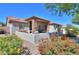 The backyard patio features stone pillars, desert landscaping, and outdoor seating with a relaxing atmosphere at 226 W Crimson Sky Ct, Casa Grande, AZ 85122
