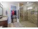 The modern bathroom features a glass walk-in shower and a walk-in closet at 226 W Crimson Sky Ct, Casa Grande, AZ 85122