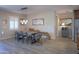 The dining room offers a unique table, modern chandelier, and bright natural light at 226 W Crimson Sky Ct, Casa Grande, AZ 85122