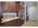 The kitchen features granite counters, subway tile, and stainless steel double oven at 226 W Crimson Sky Ct, Casa Grande, AZ 85122