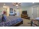 A spacious main bedroom with hardwood floors, a ceiling fan, and ample natural light at 226 W Crimson Sky Ct, Casa Grande, AZ 85122