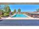 Sparkling pool with hot tub and lush landscaping in a well maintained backyard at 226 W Crimson Sky Ct, Casa Grande, AZ 85122
