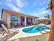 Beautiful backyard with a pool, lounge chairs, and a covered patio, great for enjoying sunny days and outdoor living at 230 S 122Nd Ln, Avondale, AZ 85323