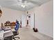 Comfortable bedroom with a desk, bookcase, and doorway leading to other rooms at 230 S 122Nd Ln, Avondale, AZ 85323