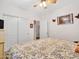 Comfortable bedroom with ceiling fan, carpet, and natural light from the window at 230 S 122Nd Ln, Avondale, AZ 85323