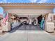 Spacious three car garage with ample storage options and an American Flag displayed at 230 S 122Nd Ln, Avondale, AZ 85323