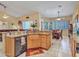 Open-concept kitchen with granite countertops, stainless steel appliances, and seamless view of the dining area at 230 S 122Nd Ln, Avondale, AZ 85323