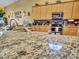 Close-up of kitchen featuring granite countertops and stainless steel appliances at 230 S 122Nd Ln, Avondale, AZ 85323