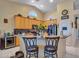 Bright kitchen features granite countertops, stainless steel appliances, and a breakfast bar with seating at 230 S 122Nd Ln, Avondale, AZ 85323