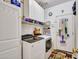 Bright laundry room with plenty of storage space and modern appliances at 230 S 122Nd Ln, Avondale, AZ 85323