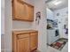 Functional laundry room featuring built-in cabinets and a washing machine and dryer at 230 S 122Nd Ln, Avondale, AZ 85323