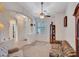 Spacious living area featuring neutral carpet and a ceiling fan at 230 S 122Nd Ln, Avondale, AZ 85323