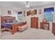 Spacious main bedroom featuring a wooden bed, matching dresser, and serene ambiance at 230 S 122Nd Ln, Avondale, AZ 85323