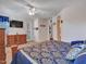 Tranquil main bedroom boasts a king-size bed, dresser, and a door to the outside at 230 S 122Nd Ln, Avondale, AZ 85323