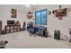 Inviting home office featuring a large desk, comfortable chair, and ample natural light at 230 S 122Nd Ln, Avondale, AZ 85323