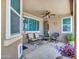 Covered patio with a ceiling fan, tiled flooring, patio furniture and views of the backyard at 230 S 122Nd Ln, Avondale, AZ 85323