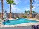 Backyard pool with a cool blue water, palm trees, and lounge chairs on a sunny day at 230 S 122Nd Ln, Avondale, AZ 85323