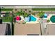 Aerial view of a backyard oasis featuring a pool, lounge area, and lush desert landscaping at 230 S 122Nd Ln, Avondale, AZ 85323