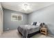Cozy bedroom with a ceiling fan, neutral walls, carpet, and a window for natural light at 2330 E Elmwood St, Mesa, AZ 85213