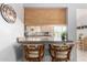 Charming breakfast bar with seating and views into the kitchen at 2330 E Elmwood St, Mesa, AZ 85213