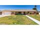 Charming single-story home with a well-manicured lawn and colorful landscaping at 2330 E Elmwood St, Mesa, AZ 85213