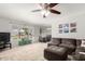 Cozy living room with neutral tones, plush sectional sofa, and large window at 2330 E Elmwood St, Mesa, AZ 85213