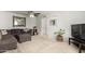 Comfortable living room featuring a sectional sofa, soft carpet, and stylish decor at 2330 E Elmwood St, Mesa, AZ 85213