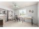 Home office with natural light, a ceiling fan, and built in shelving at 2330 E Elmwood St, Mesa, AZ 85213