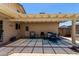 Covered patio with dining table and chairs offers a relaxing outdoor space at 2330 E Elmwood St, Mesa, AZ 85213