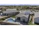 Aerial view of a house with a pool, solar panels, and a well-maintained landscaped yard at 2354 E Lieber Pl, Phoenix, AZ 85024