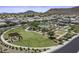 A beautiful aerial view of the community park, featuring playground, picnic shelter and mountain views at 2354 E Lieber Pl, Phoenix, AZ 85024