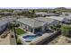 An aerial view reveals a home with a private pool, patio area, and desert landscaping at 2354 E Lieber Pl, Phoenix, AZ 85024