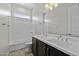 Bathroom featuring a double sink vanity, bathtub and natural light at 2354 E Lieber Pl, Phoenix, AZ 85024