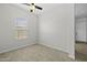 Well-lit bedroom with a ceiling fan and a window with natural light at 2354 E Lieber Pl, Phoenix, AZ 85024