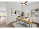 Stylish home office with a sleek desk, modern decor, and ample natural light, ideal for remote work at 2354 E Lieber Pl, Phoenix, AZ 85024