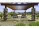 Outdoor picnic area with a wooden pavilion and stone pillars, providing a perfect spot for gatherings at 2354 E Lieber Pl, Phoenix, AZ 85024