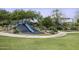 Community playground with a blue slide on a soft landing offering safe and fun recreational opportunities at 2354 E Lieber Pl, Phoenix, AZ 85024