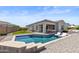Stunning backyard oasis with a sparkling pool, lounge chairs and outdoor dining area, perfect for entertaining at 2354 E Lieber Pl, Phoenix, AZ 85024