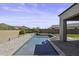 Beautiful backyard oasis featuring a sparkling pool, desert landscaping and mountain views at 2354 E Lieber Pl, Phoenix, AZ 85024