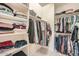 Walk-in closet with ample storage space, shelving and hanging rods for organizing clothes, shoes and accessories at 266 N Piedra Way, Mesa, AZ 85207