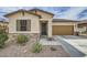Charming single-story home with desert landscaping, stone accents, and a two-car garage at 266 N Piedra Way, Mesa, AZ 85207