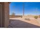 Spacious backyard with a gravel landscape, privacy wall, and potential for outdoor entertaining at 29109 N Fire Agate Rd, San Tan Valley, AZ 85143