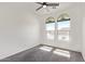 Bedroom with two windows allowing natural light and dark carpet at 29109 N Fire Agate Rd, San Tan Valley, AZ 85143