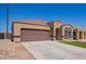 Attractive home with a desert landscape, a tile roof, and a convenient two-car garage at 29109 N Fire Agate Rd, San Tan Valley, AZ 85143