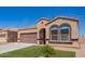 Close view of a single-Gathering home, featuring desert landscaping and a large front-facing window at 29109 N Fire Agate Rd, San Tan Valley, AZ 85143