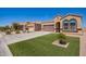 Beautiful desert home with neat landscaping, a spacious driveway, and a two-car garage at 29109 N Fire Agate Rd, San Tan Valley, AZ 85143