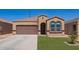 Well-maintained home with a neat lawn, a two-car garage and desert landscaping at 29109 N Fire Agate Rd, San Tan Valley, AZ 85143