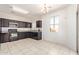 Classic kitchen featuring dark wood cabinets, granite countertops, and appliances ready for cooking and entertaining at 29109 N Fire Agate Rd, San Tan Valley, AZ 85143